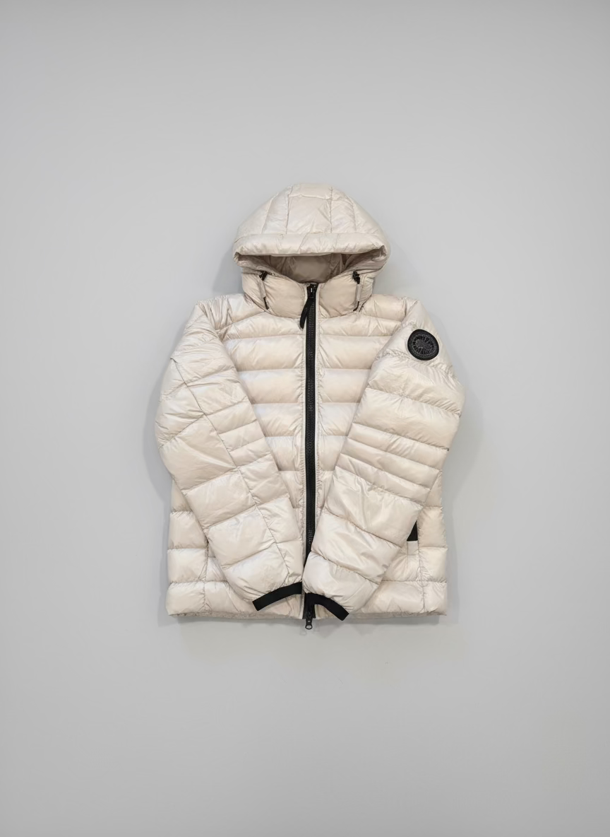 White puffer jacket with a hood on a black background