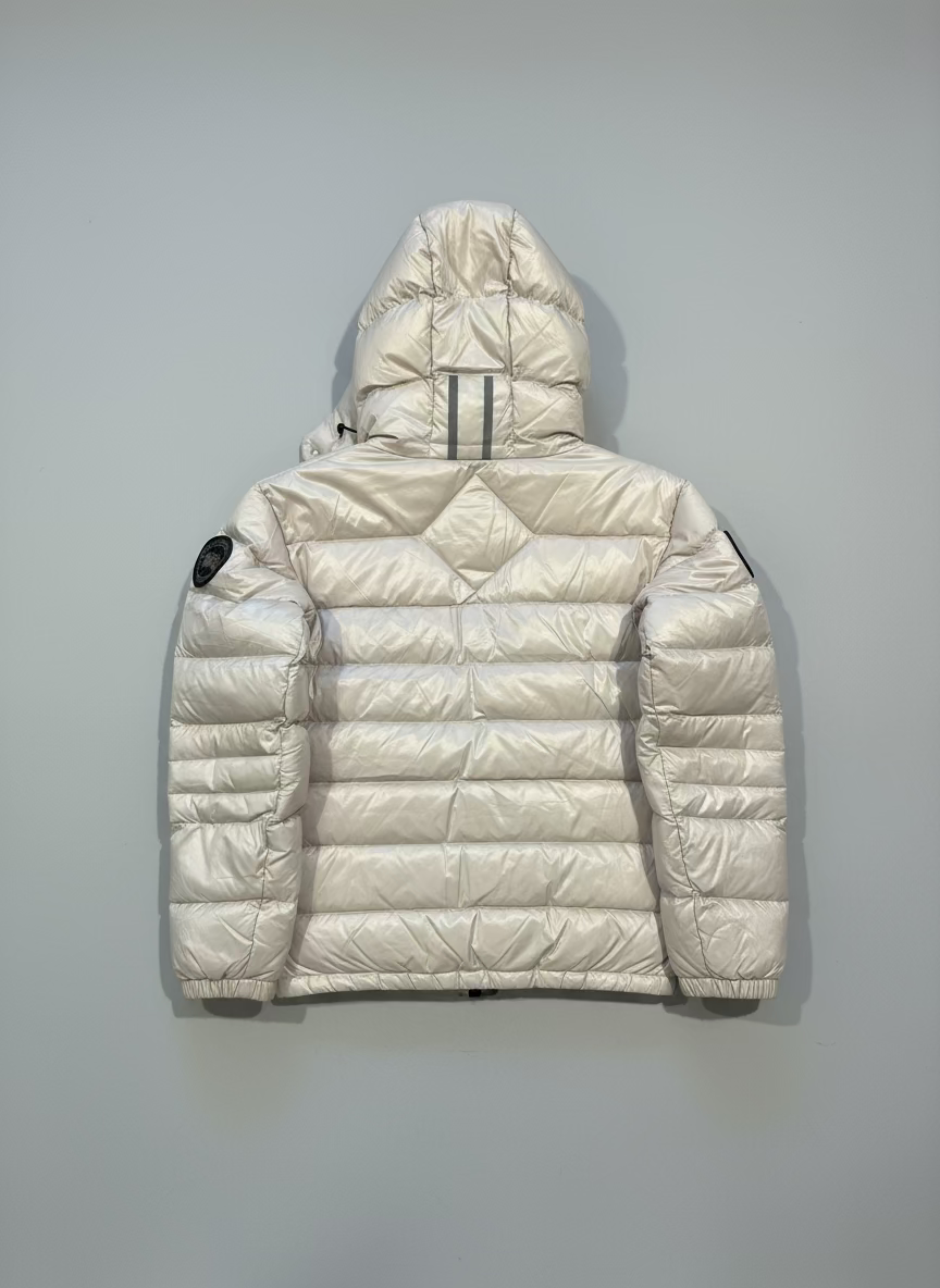 White puffer jacket with a hood on a black background